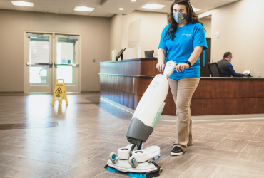woman cleaning tile floor