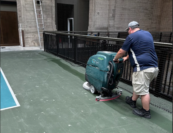 A person cleaning a floor with a machine

AI-generated content may be incorrect.