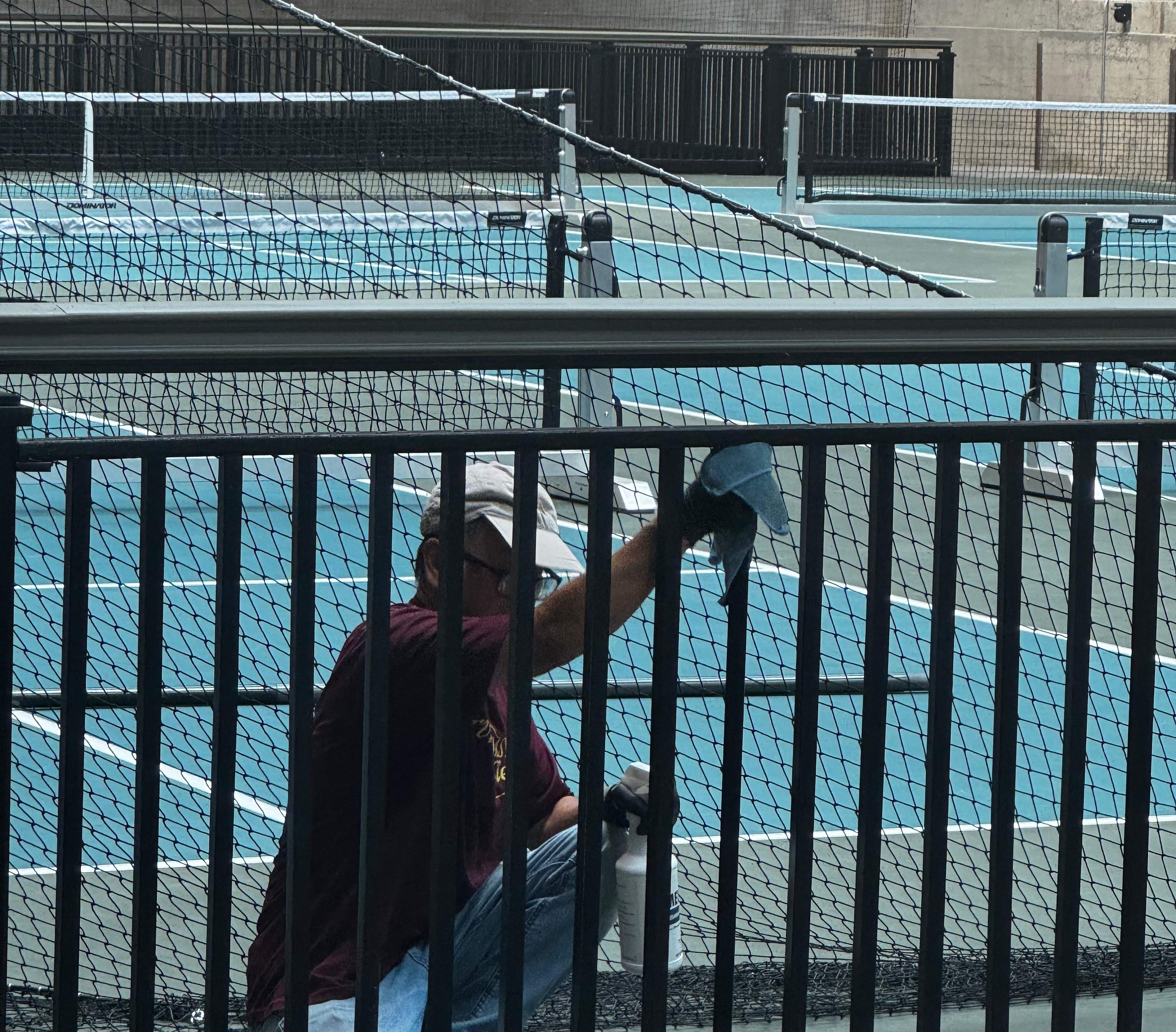 A person painting a tennis court

AI-generated content may be incorrect.