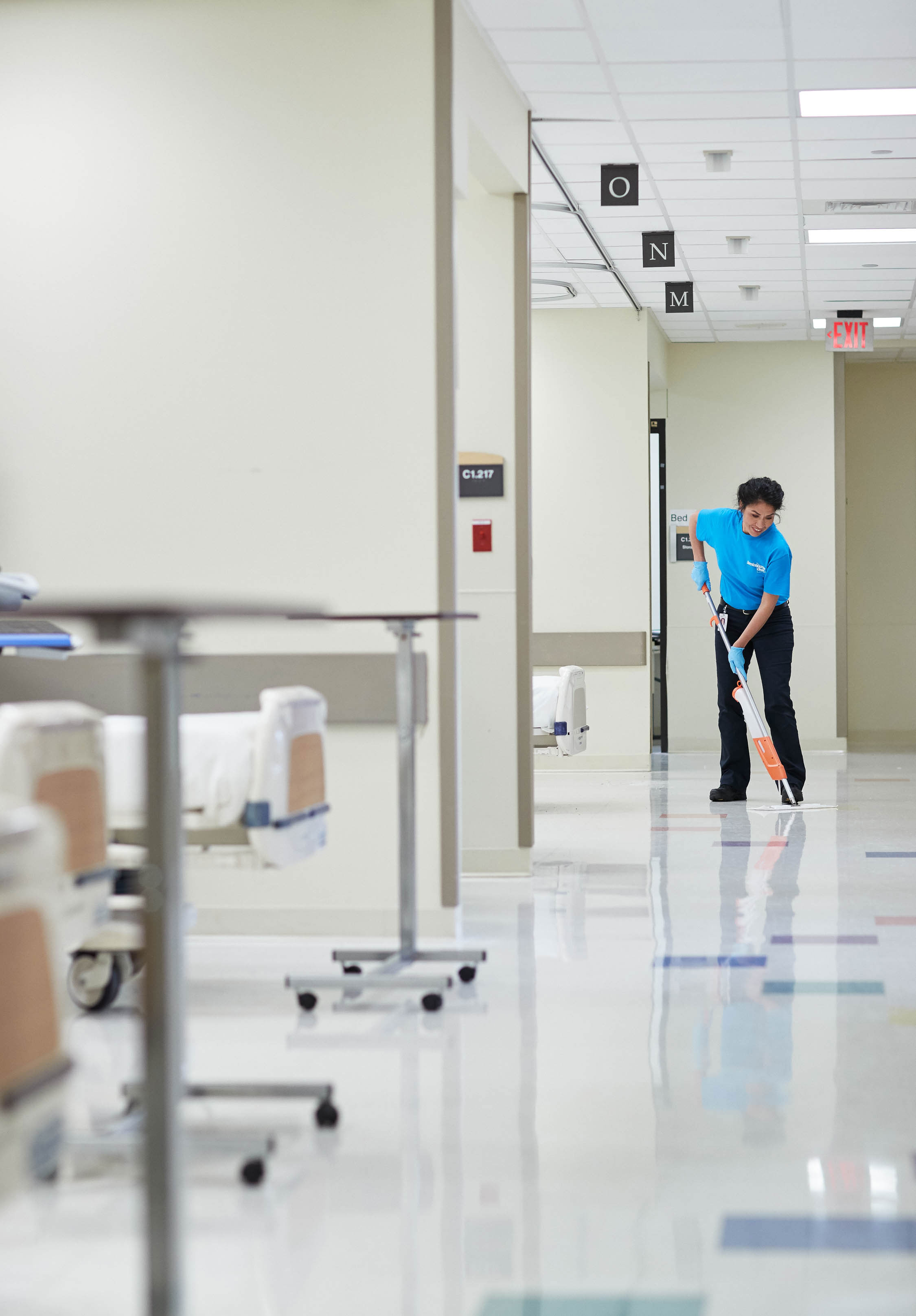 man moping hospital floor