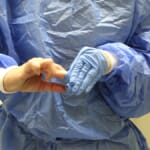 Healthcare worker performing hand hygiene