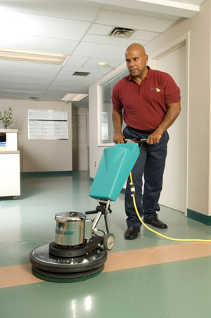 Man buffing Tile floor